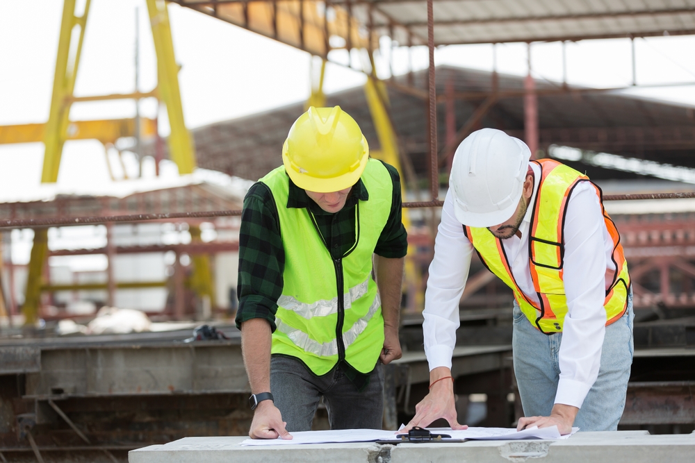 construction project managers examining plans