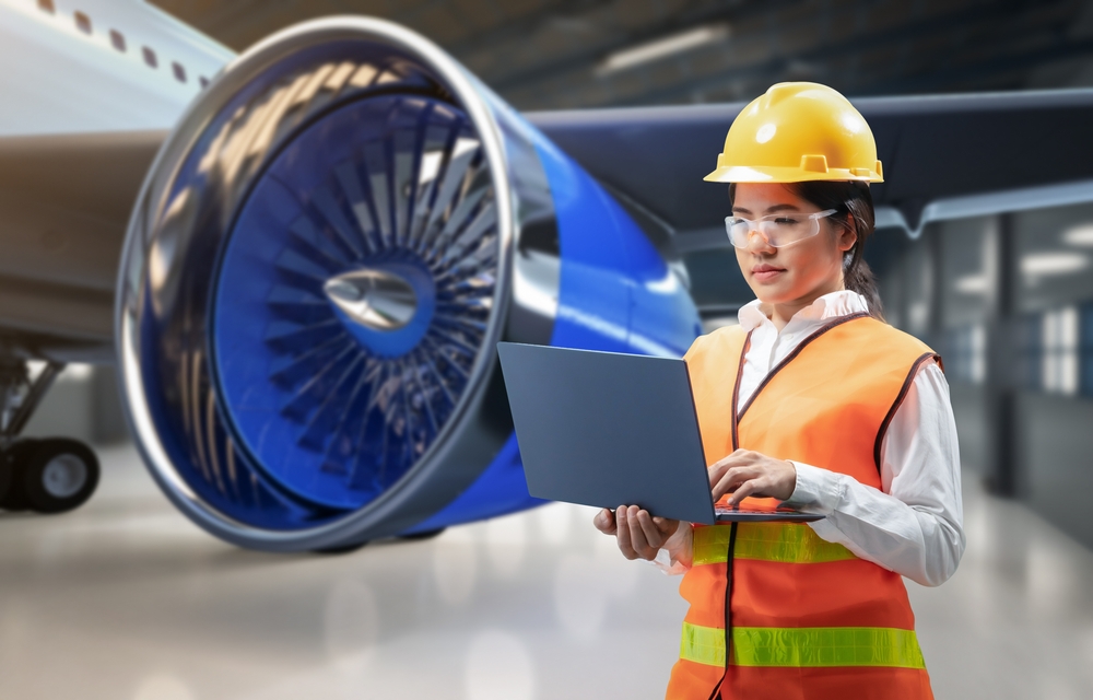 aerospace engineer next to plane